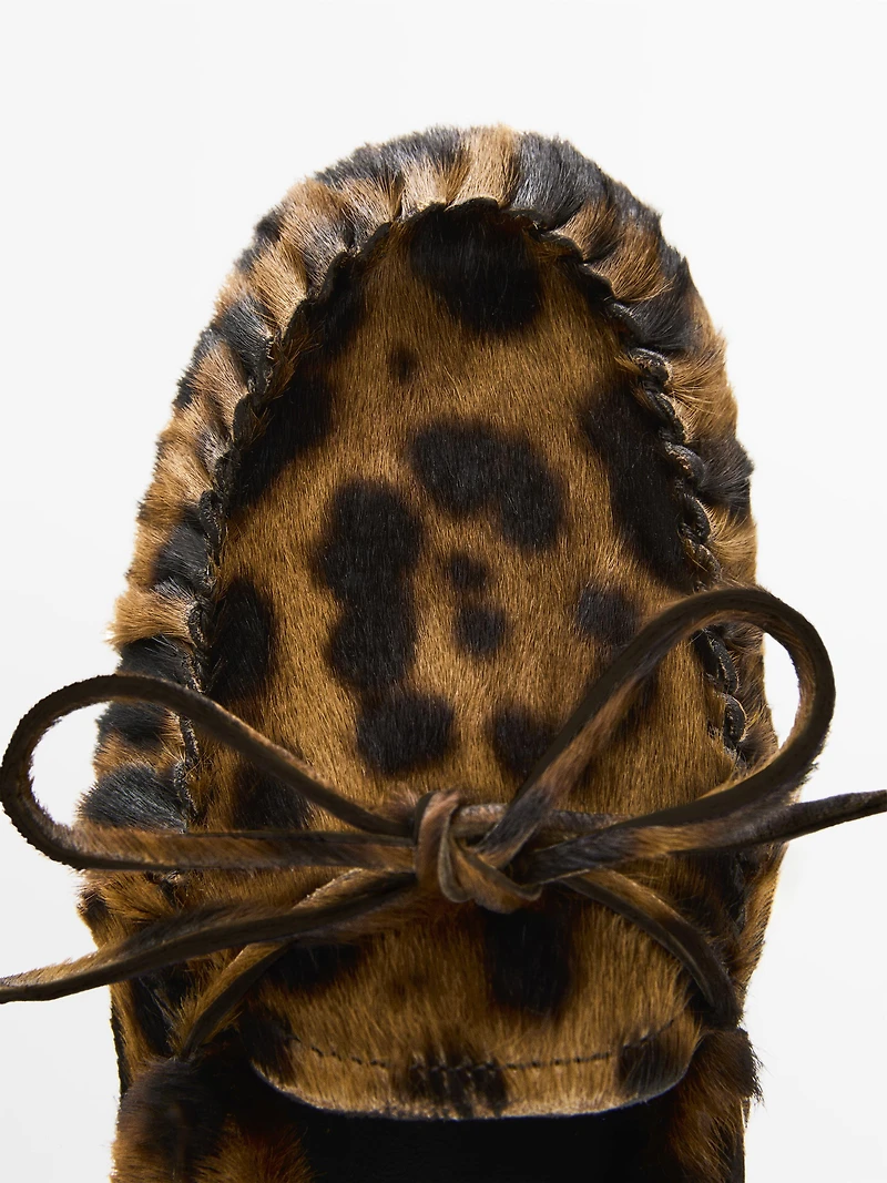 Animal print deck shoes