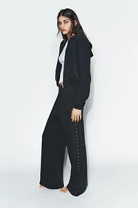WASHED EFFECT FLEECE PANTS WITH STUDS