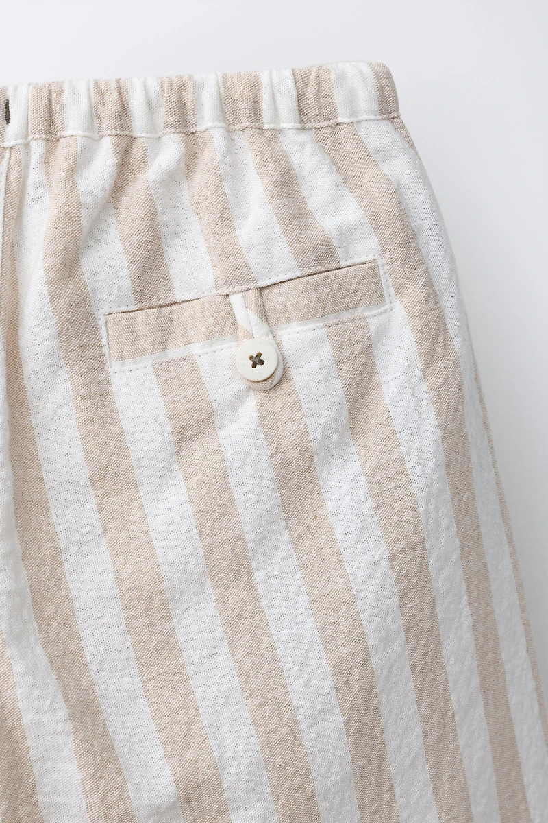 PANTALON BALLON À PLIS ET RAYURES