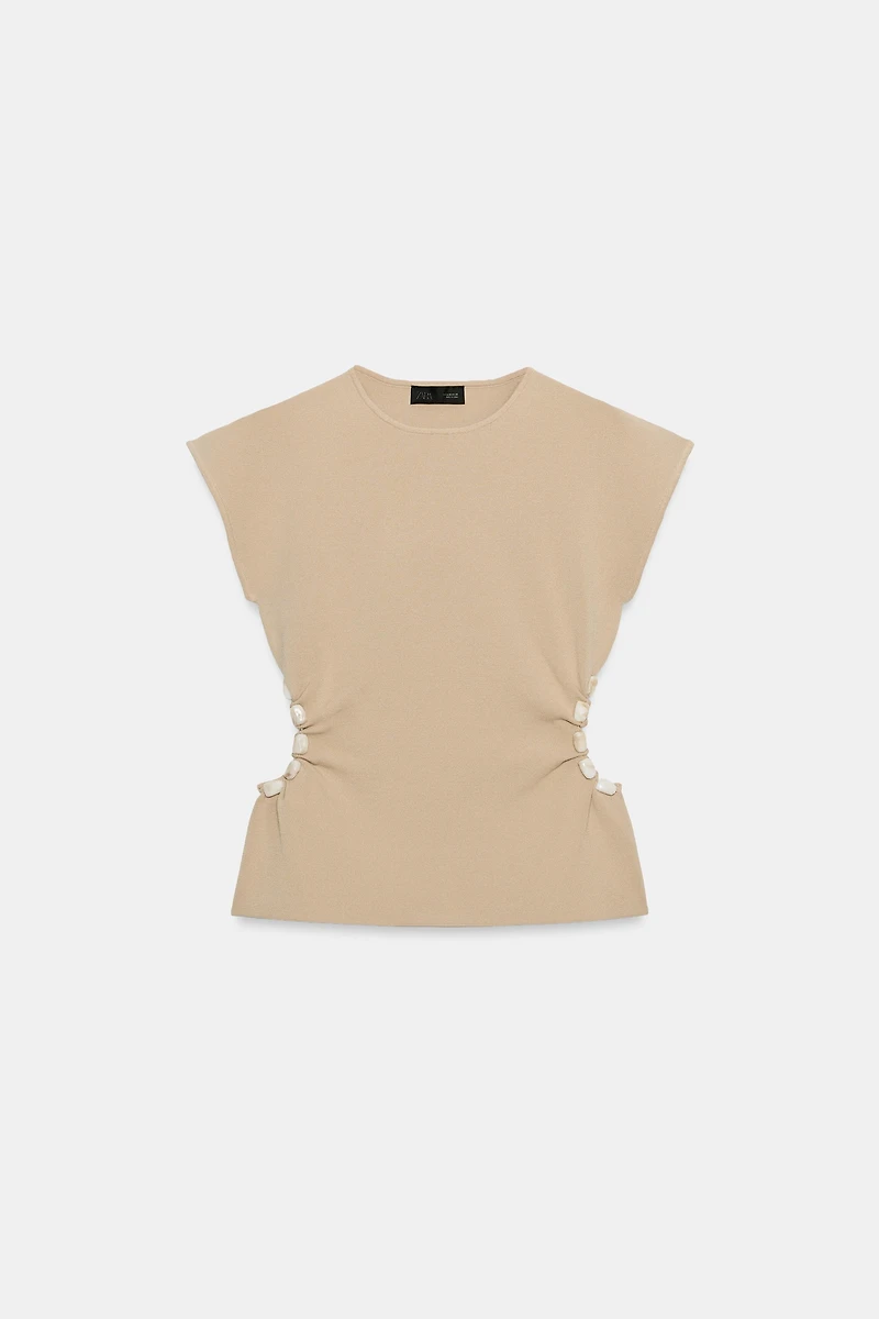 TOP EN MAILLE AJOURÉ AVEC PERLES