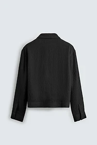 BLOUSON STRUCTURÉ IRRÉGULIER