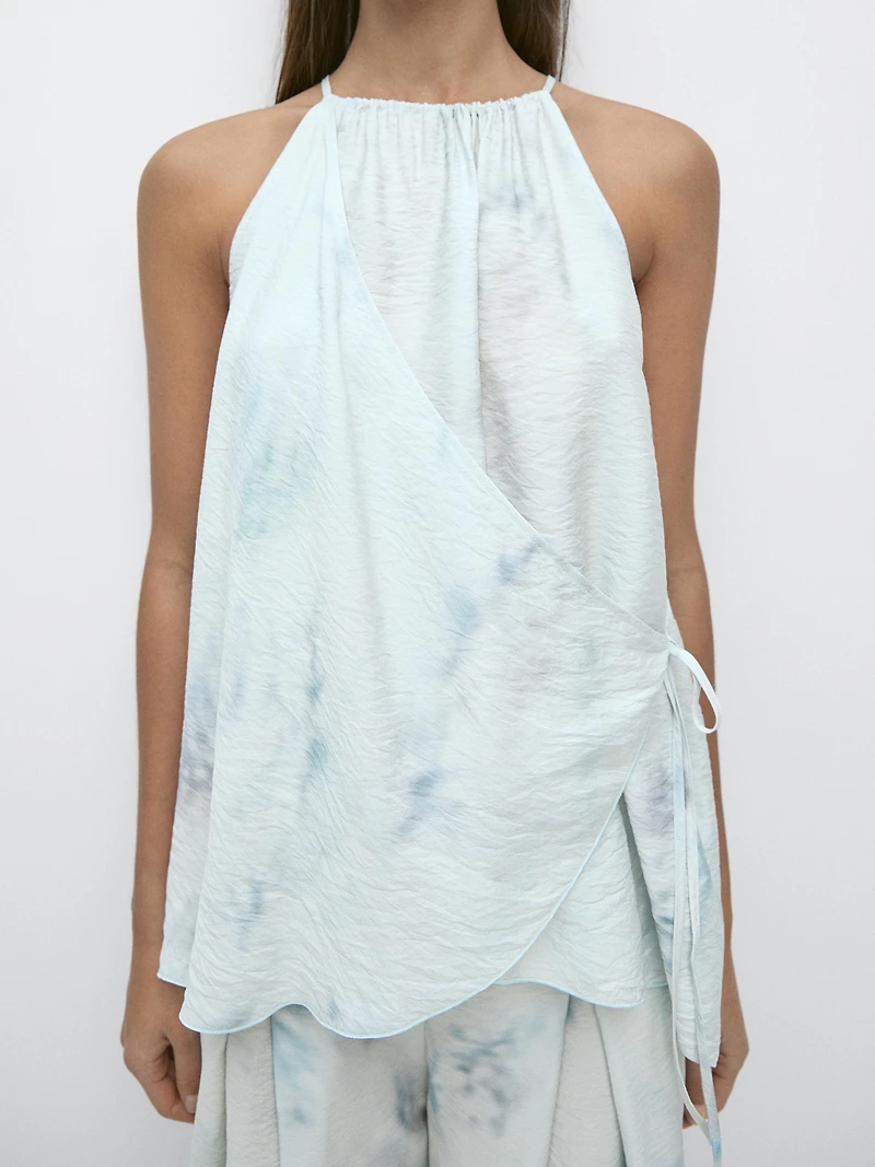 Flowing halterneck top with tie detail