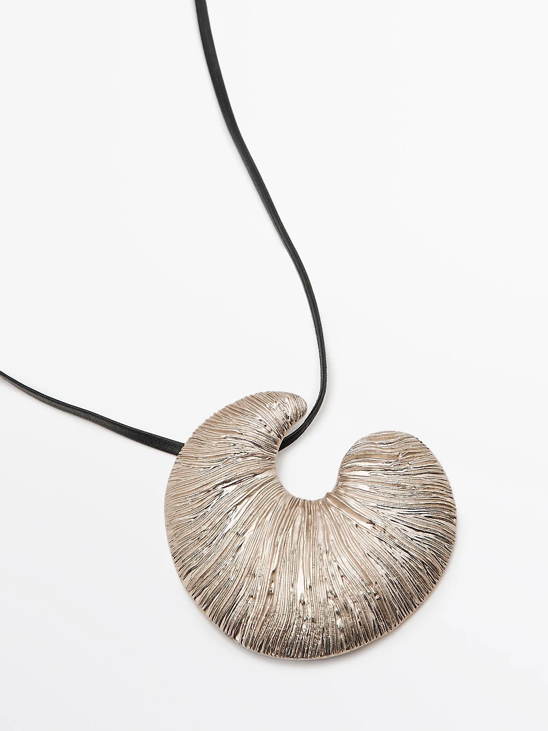 Necklace with fossil piece pendant