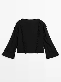 Flowing blouse with ruffles and zip