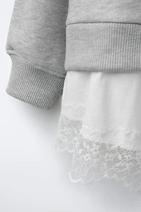 DOUBLE HEM LACE SWEATSHIRT