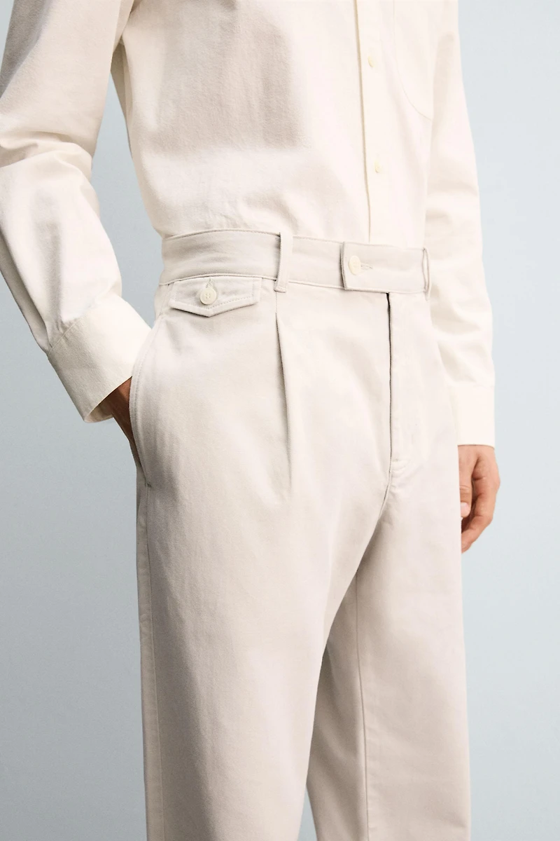 RELAXED FIT PLEATED PANTS