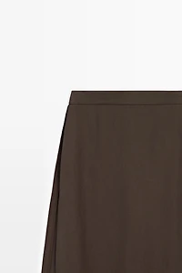 Flowing trousers with skirt detail