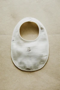 BABY MUSLIN BIB WITH ELEPHANTS