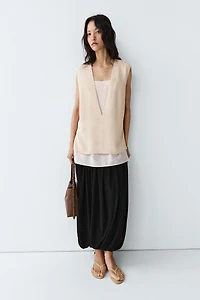 Flowing double-layer top with contrast detail