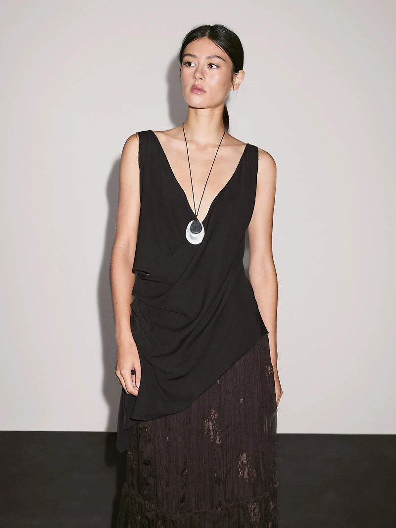Long pleated skirt with embroidered detail