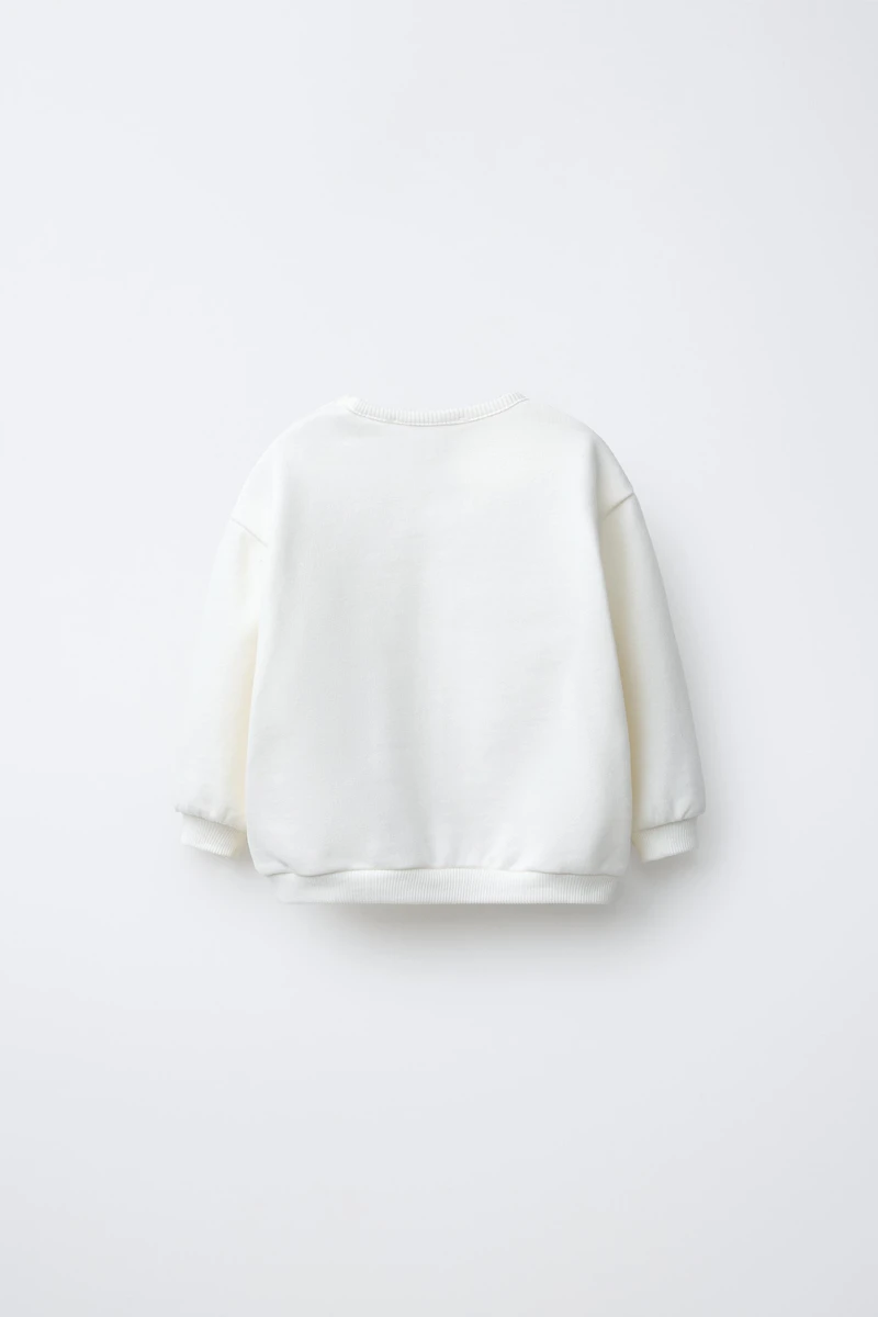 FLOCKED PRINT SWEATSHIRT