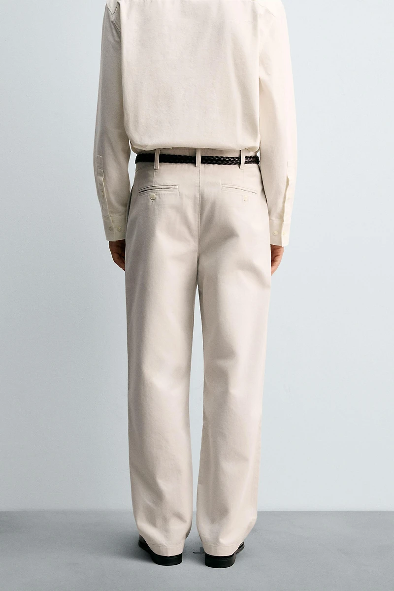 RELAXED FIT PLEATED PANTS