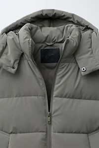 MANTEAU LONG À ÉTIQUETTE GOMMÉE