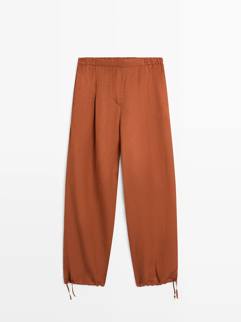 Flowing trousers with tie detail