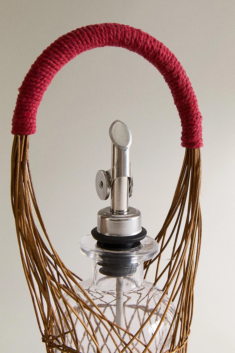 GLASS CRUET WITH RATTAN BASKET