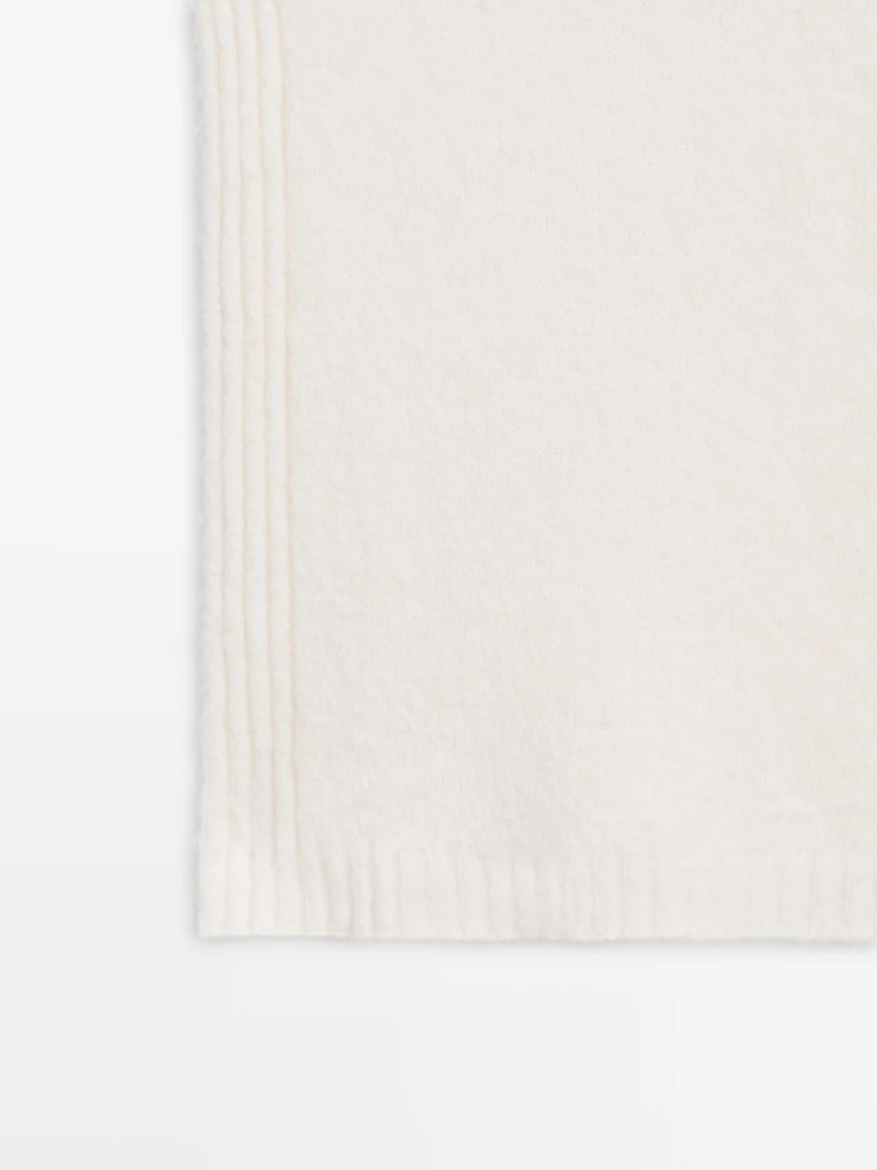 Sleeveless high neck sweater