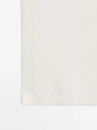 Sleeveless high neck sweater