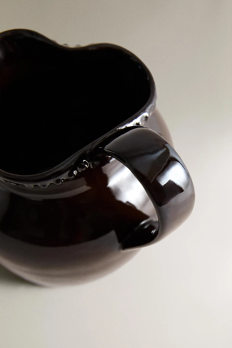 RAISED DESIGN STONEWARE JUG