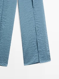 Flowing palazzo trousers with slits