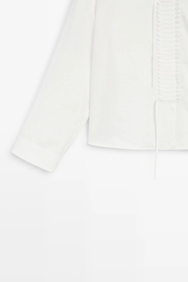 Flowing linen blend blouse with button detail