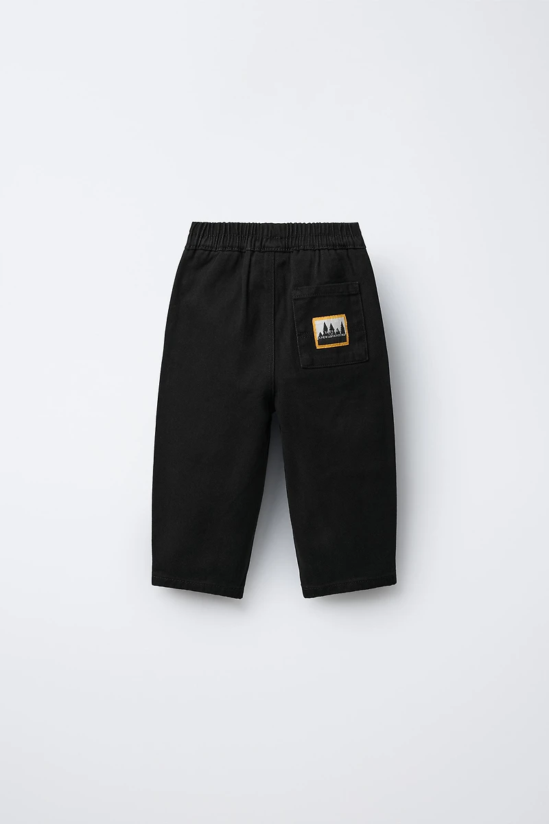 BALLOON PLEATED PANTS WITH LABELS