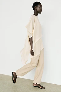 Asymmetric cape-style flowing blouse