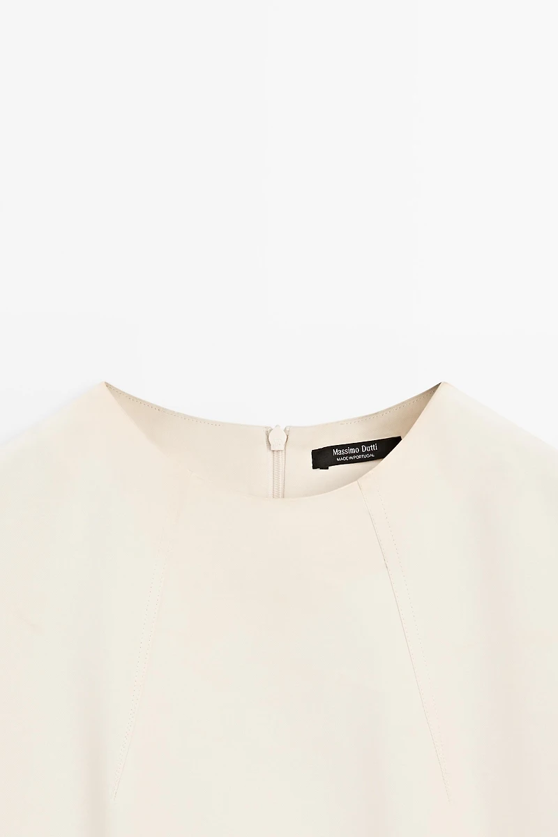 Flowing elbow-length sleeve top