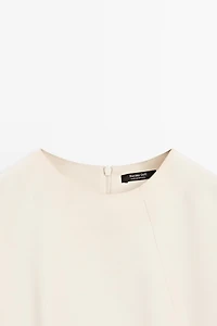 Flowing elbow-length sleeve top