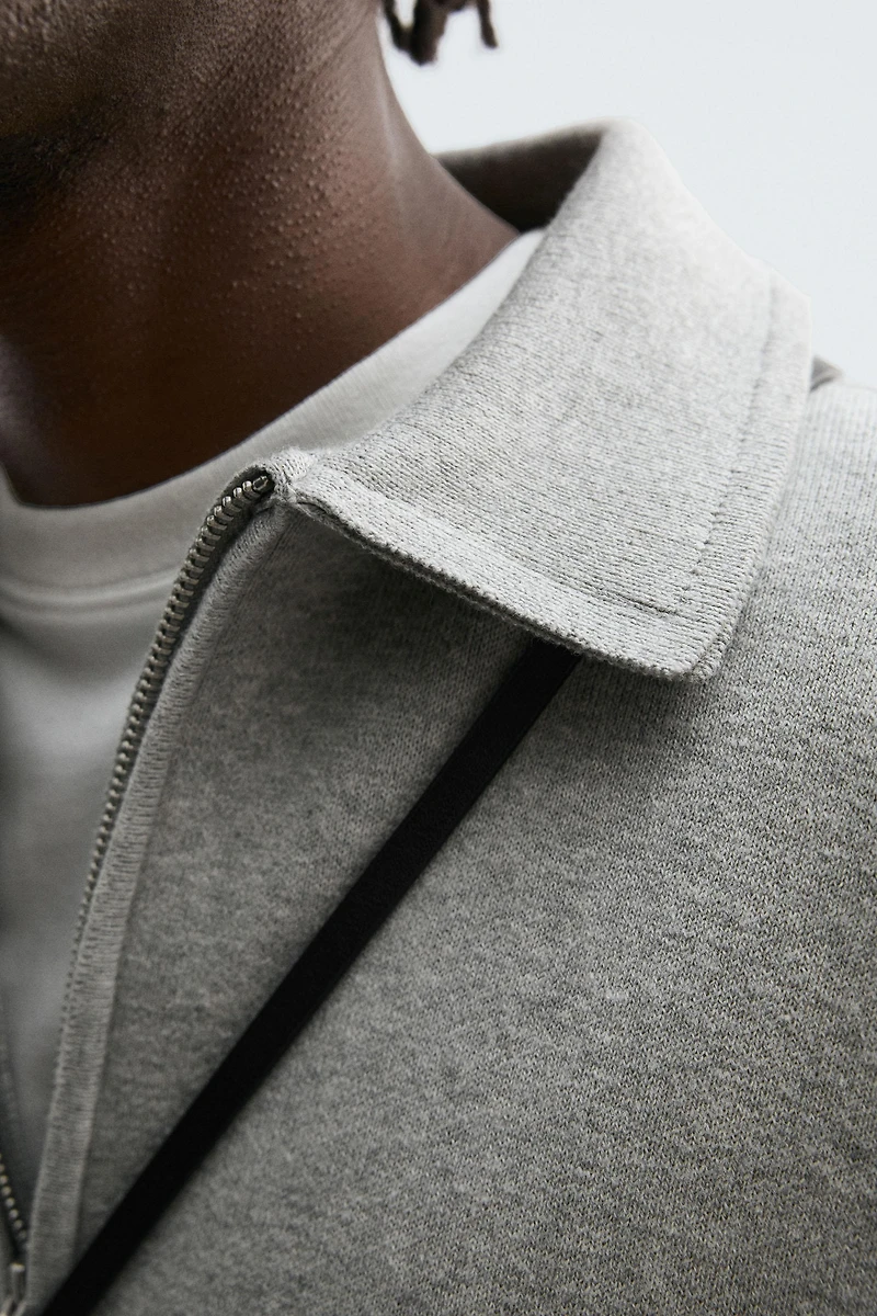 POLO EN MAILLE À COL ZIPPÉ