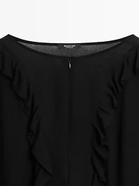 Flowing blouse with ruffles and zip