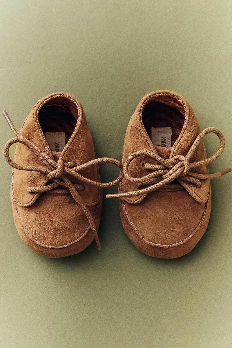 CHAUSSON BOTTE LACETS CUIR