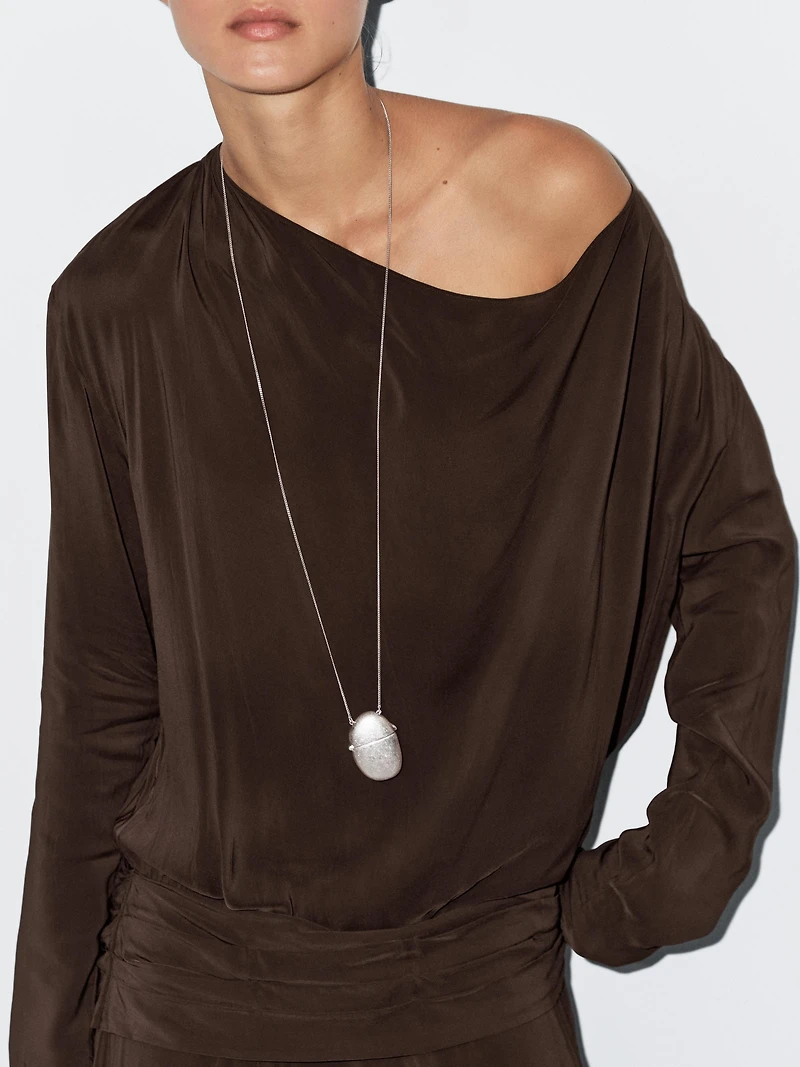 Long flowing dress with draped sash belt