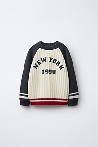 TEXTURED KNIT TEXT JUMPER