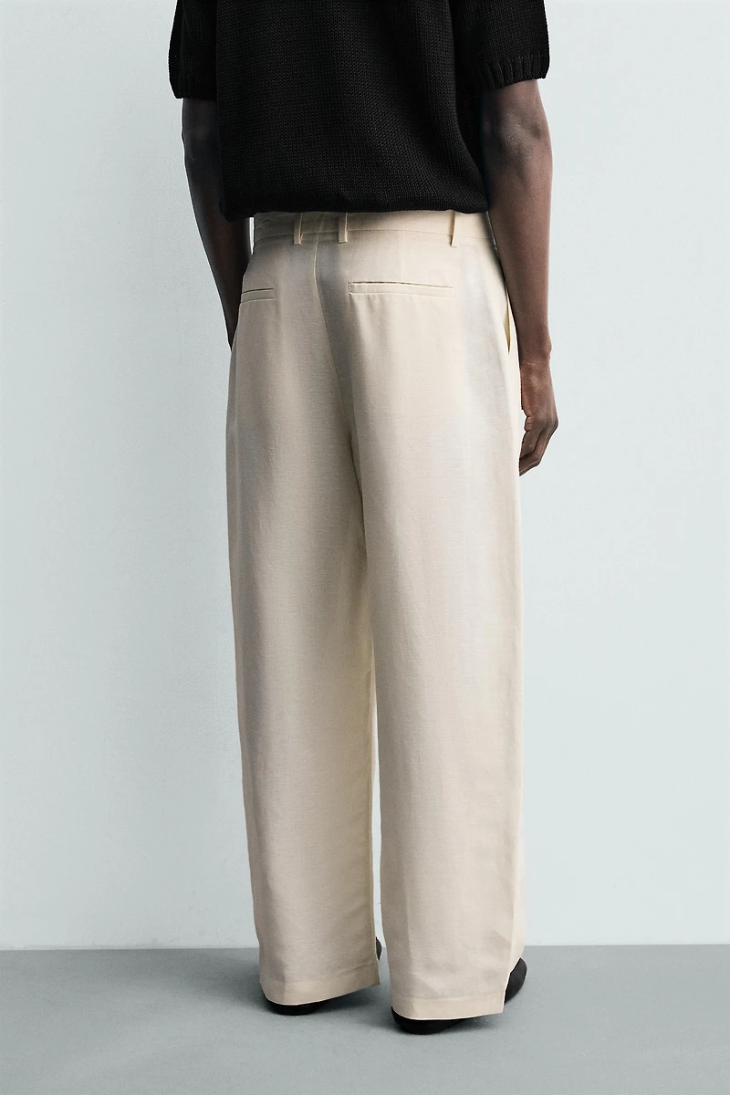 RELAXED FIT PLEATED PANTS