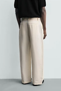 RELAXED FIT PLEATED PANTS
