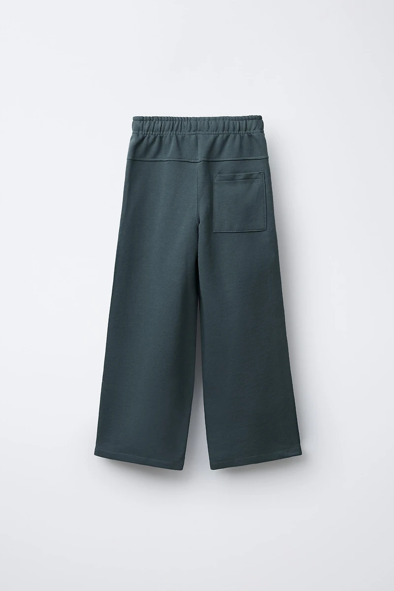 PANTALON EN MOLLETON AVEC ÉTIQUETTE