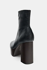 PLATFORM HEELED ANKLE BOOTS
