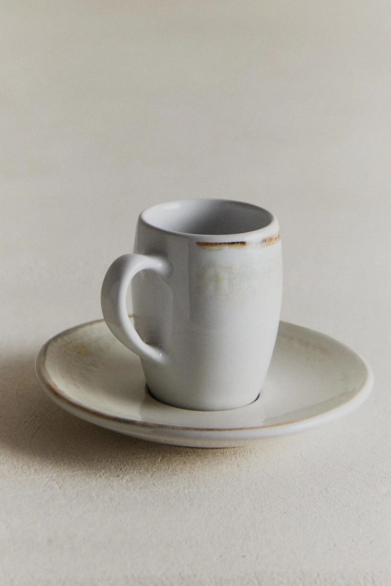 STONEWARE COFFEE CUP AND SAUCER