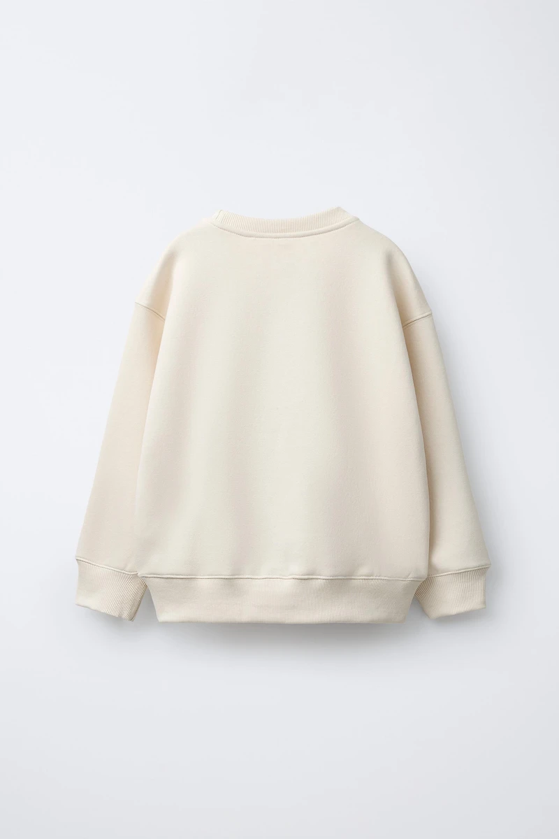 SWEAT À INSCRIPTION FLOQUÉE