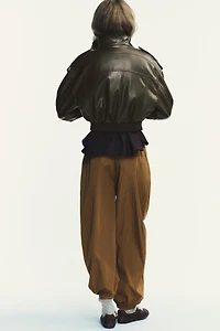 PANTALON EN NYLON BOUFFANT AVEC POIGNETS ÉLASTIQUES