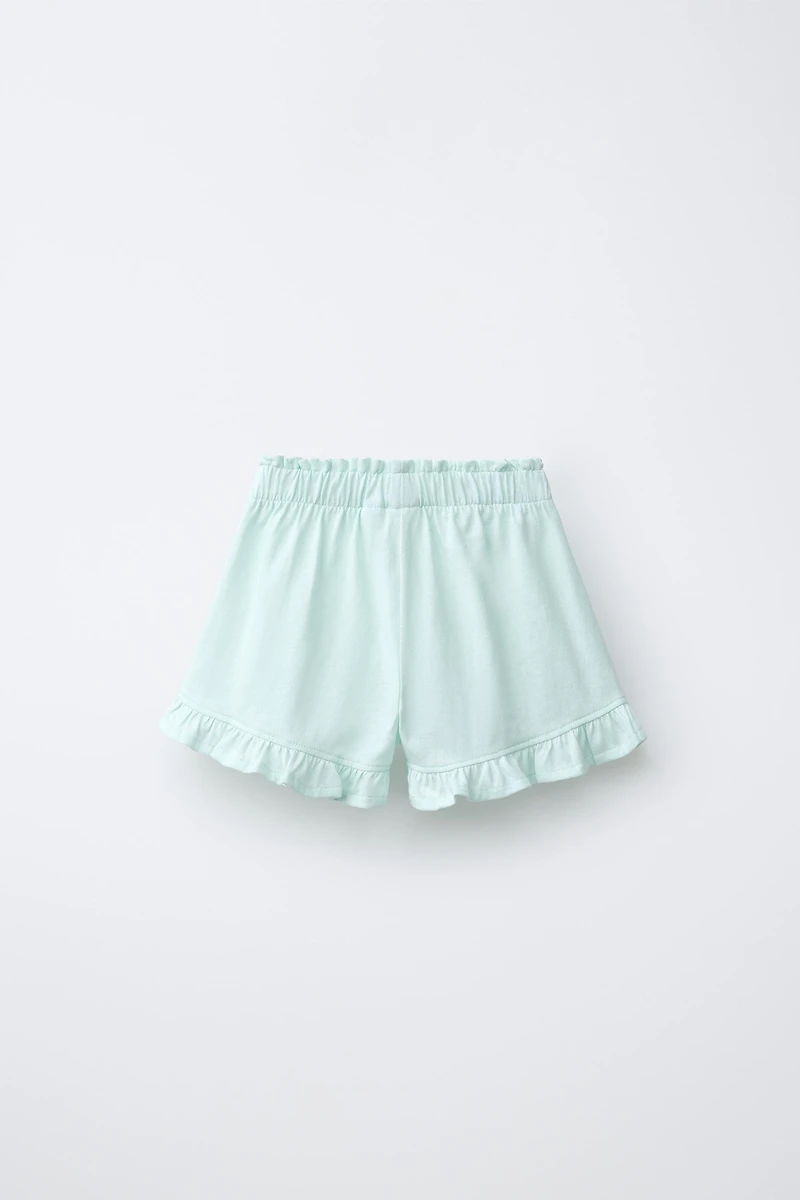 TROPICAL PRINT RUFFLE HEM SHORTS