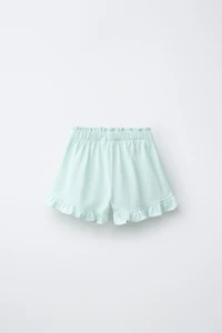 TROPICAL PRINT RUFFLE HEM SHORTS