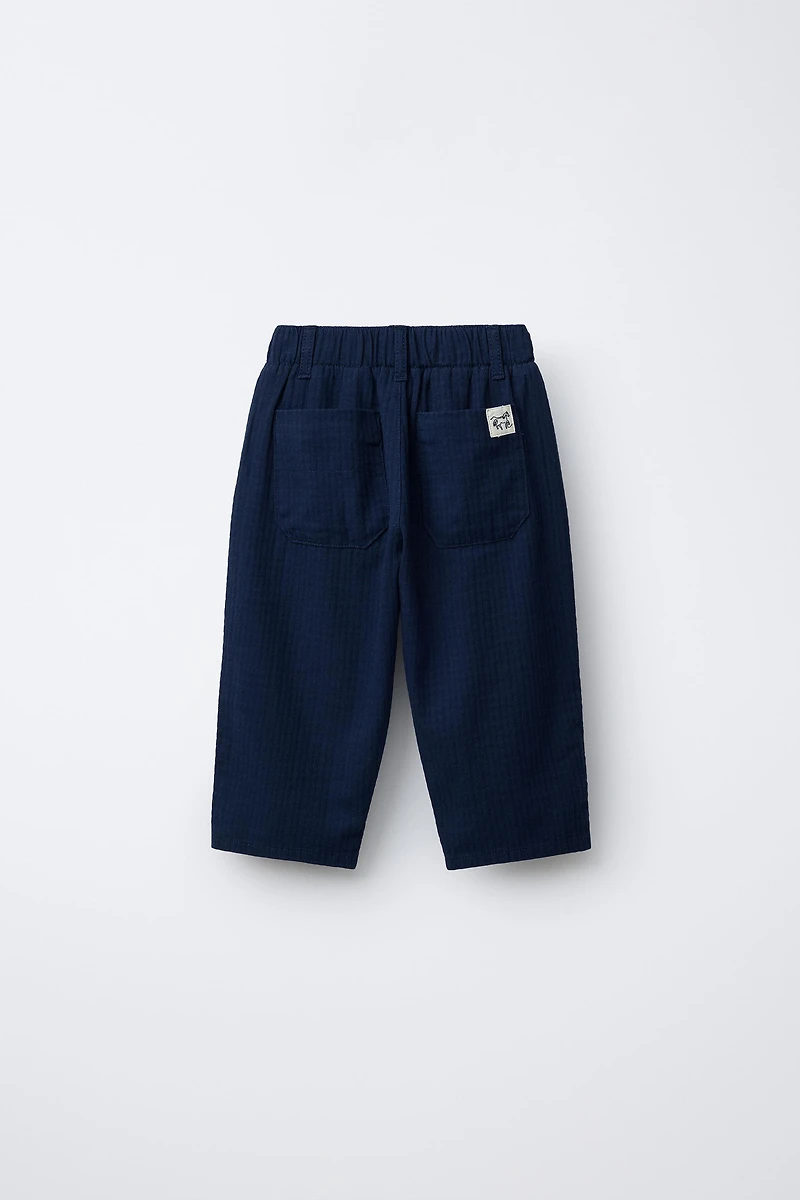 TEXTURED PANTS WITH LABEL