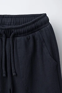 TEXTURED PANTS WITH LABEL