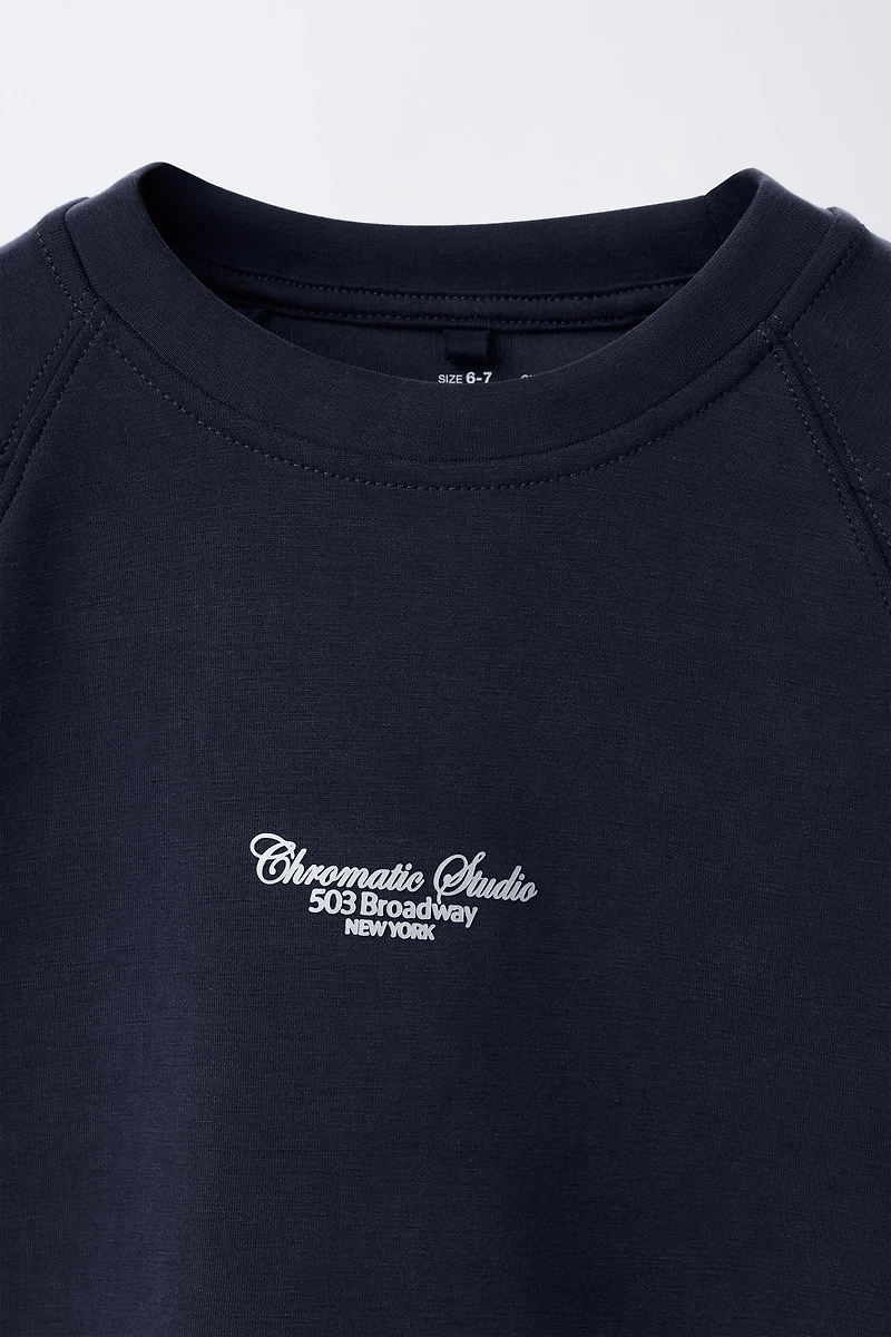 RAISED TEXT SWEATSHIRT