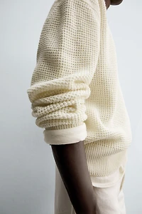 RELAXED FIT BUTTON-NECK SWEATER