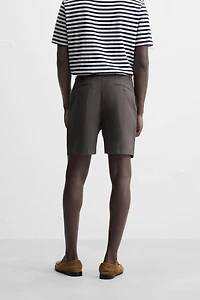 REGULAR FIT PLEATED BERMUDA SHORTS