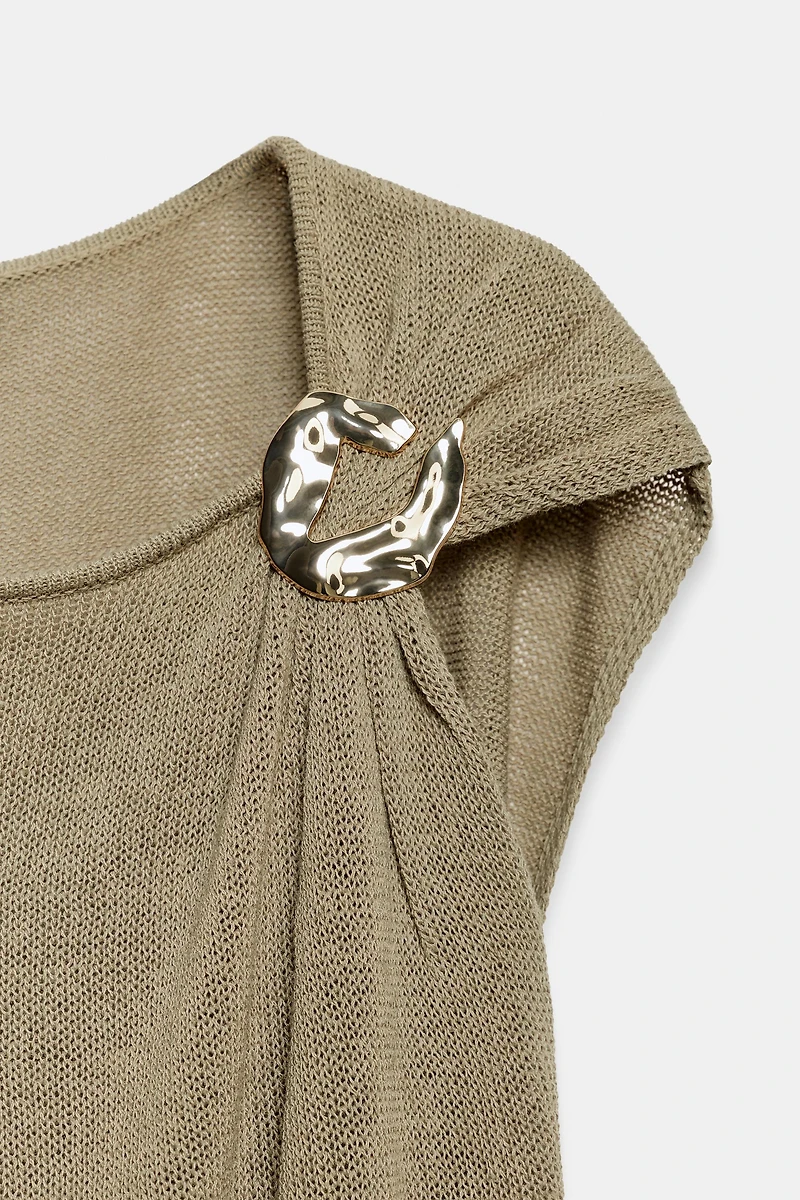 TOP EN MAILLE À FINITIONS