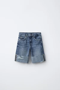 SHORT EN JEAN LONG DÉCHIRURES