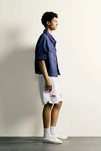 SHORT DE SURVÊTEMENT BRODÉ À PIÈCES